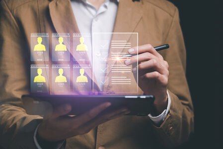 Businessman showing virtual icons, assessment checkboxes ,data a