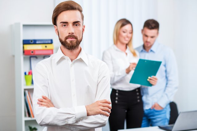 Happy smart business man with team mates